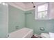 Bathroom features green tiling and a bathtub at 504 Forest Ridge Dr, Shelby, NC 28152