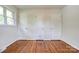 Bedroom featuring hardwood floors, three closets, and a window at 504 Forest Ridge Dr, Shelby, NC 28152