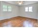 A bright bedroom with hardwood floors and two windows at 504 Forest Ridge Dr, Shelby, NC 28152