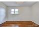 A bright bedroom with hardwood floors and a ceiling fan at 504 Forest Ridge Dr, Shelby, NC 28152