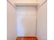 Walk-in closet with built-in shelving and hardwood floors at 504 Forest Ridge Dr, Shelby, NC 28152