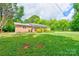 Charming single-story home with a well-manicured lawn and brick exterior at 504 Forest Ridge Dr, Shelby, NC 28152