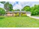 Charming single-story brick home featuring a well-manicured lawn and mature trees offering shade at 504 Forest Ridge Dr, Shelby, NC 28152
