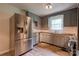 Functional kitchen with stainless steel refrigerator and updated countertops at 504 Forest Ridge Dr, Shelby, NC 28152