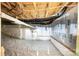Unfinished basement featuring insulation, exposed ceiling, and visible utilities, ready for customization and expansion at 5214 Polo Gate Blvd, Charlotte, NC 28216