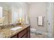 Cozy bathroom featuring granite countertops, neutral wall paint, and a tiled shower and floor at 5214 Polo Gate Blvd, Charlotte, NC 28216
