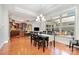 Spacious dining area adjacent to kitchen, featuring a chandelier and a large window at 5214 Polo Gate Blvd, Charlotte, NC 28216