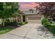 Beautiful single-Gathering home with a stone facade, well-manicured lawn, and two-car garage at 5214 Polo Gate Blvd, Charlotte, NC 28216