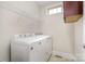 Efficient laundry room with modern white Maytag washer and dryer appliances, offering convenience and functionality at 5214 Polo Gate Blvd, Charlotte, NC 28216