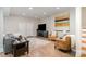 Inviting living room with a TV, comfortable sofa, two chairs, and stylish rug, ideal for relaxation and socializing at 5214 Polo Gate Blvd, Charlotte, NC 28216