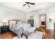Comfortable main bedroom with a ceiling fan and a side table at 5214 Polo Gate Blvd, Charlotte, NC 28216
