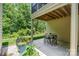 Comfortable outdoor dining on the patio, surrounded by nature at 5214 Polo Gate Blvd, Charlotte, NC 28216