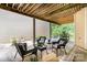 Charming covered patio with stylish furniture and views of lush landscaping at 5214 Polo Gate Blvd, Charlotte, NC 28216