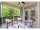 Relaxing screened porch with comfortable seating and a peaceful view at 5214 Polo Gate Blvd, Charlotte, NC 28216