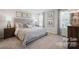 Comfortable bedroom with neutral décor, large windows and an adjacent nightstand at 543 Nesbe St # 2215, Lancaster, SC 29720