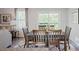Dining room with a wooden table, 6 chairs and sliding doors leading to a deck at 543 Nesbe St # 2215, Lancaster, SC 29720