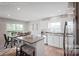 Bright kitchen with island, stainless steel appliances, granite countertops and an adjacent dining area at 543 Nesbe St # 2215, Lancaster, SC 29720