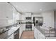 Modern kitchen with stainless steel appliances, granite countertops, and ample cabinet space at 543 Nesbe St # 2215, Lancaster, SC 29720