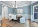 Light-filled dining area with stylish decor, a jute rug, and a modern chandelier at 552 Wyndham Ln, Marvin, NC 28173