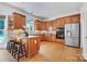 Well-equipped kitchen with custom cabinetry, stainless steel appliances, and breakfast bar at 552 Wyndham Ln, Marvin, NC 28173