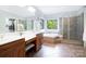 Primary bathroom boasts double vanity, walk in shower, soaker tub and a walk-in closet at 552 Wyndham Ln, Marvin, NC 28173