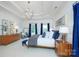 Primary bedroom showcasing decor, tray ceiling, windows and a statement chandelier at 552 Wyndham Ln, Marvin, NC 28173