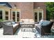 Outdoor living space with wicker furniture, perfect for enjoying warm weather and outdoor gatherings at 552 Wyndham Ln, Marvin, NC 28173