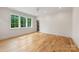 Bright bedroom with large windows, hardwood floors, and neutral paint at 5601 Robinhood Rd, Charlotte, NC 28211