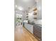 Butler's pantry with modern subway tiles and open shelving at 5601 Robinhood Rd, Charlotte, NC 28211