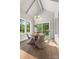 Dining area with vaulted ceilings, wood floors, large windows, sliding glass door, and modern light fixture at 5601 Robinhood Rd, Charlotte, NC 28211