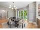 Elegant dining room featuring a chandelier and stylish wallpaper at 5601 Robinhood Rd, Charlotte, NC 28211