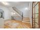 Bright foyer with hardwood floors and modern staircase design at 5601 Robinhood Rd, Charlotte, NC 28211