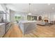 Open kitchen boasts a large island, stainless appliances, and hardwood floors at 5601 Robinhood Rd, Charlotte, NC 28211