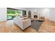 Bright living room features a fireplace, neutral decor, and access to the outdoor area through sliding glass doors at 5601 Robinhood Rd, Charlotte, NC 28211