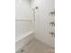 Modern walk-in shower with herringbone tile surround, a built-in bench, and modern shower fixtures at 5601 Robinhood Rd, Charlotte, NC 28211