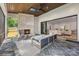 Cozy sunroom with a brick fireplace, slate floors, and sliding glass doors overlooking the backyard at 5601 Robinhood Rd, Charlotte, NC 28211