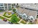 Stunning aerial view of the two-story townhome with lush landscaping in an urban community setting at 5946 Ardrey Kell Rd, Charlotte, NC 28277