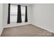 Neutral bedroom with carpet and a window with black-out curtains at 5946 Ardrey Kell Rd, Charlotte, NC 28277
