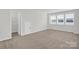 Neutral bedroom with closet and window with plenty of natural light at 5946 Ardrey Kell Rd, Charlotte, NC 28277