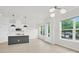 Sunlit living area featuring an island kitchen and views to the outdoors through large windows at 5946 Ardrey Kell Rd, Charlotte, NC 28277