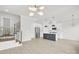 Bright, open-concept living room showcasing modern lighting and an island kitchen with stainless steel appliances at 5946 Ardrey Kell Rd, Charlotte, NC 28277