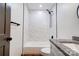 Modern bathroom featuring marble tile shower, sleek black fixtures, and granite vanity top at 600 S Cline Ave, Newton, NC 28658