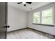 Well-lit bedroom featuring carpet, neutral walls, and double windows offering scenic views at 600 S Cline Ave, Newton, NC 28658