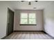 Bedroom with window offering a view of the outside and neutral carpeting at 600 S Cline Ave, Newton, NC 28658