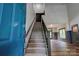 Bright entryway featuring stairs with iron railing, hardwood floors, and a view of the living area at 600 S Cline Ave, Newton, NC 28658