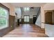 Spacious living room showcasing fireplace, hardwood floors, high ceilings, and staircase at 600 S Cline Ave, Newton, NC 28658