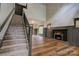 Spacious living room featuring fireplace, wood-look floors, high ceilings, and large windows at 600 S Cline Ave, Newton, NC 28658