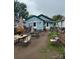 Untidy backyard featuring disorganized decor, overgrown plants and poor maintenance at 618 Douglas St, Shelby, NC 28150