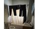 Bathroom showing a bathtub with a curtain, toilet, and sink at 618 Douglas St, Shelby, NC 28150