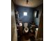 Compact bathroom featuring a toilet, sink, and overhead lighting at 618 Douglas St, Shelby, NC 28150